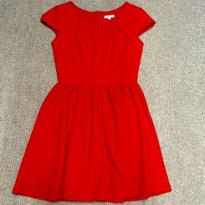 Red pleated cup sleeve dress with zipper back